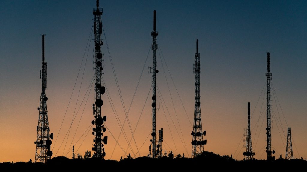 Radio towers with sunset in background