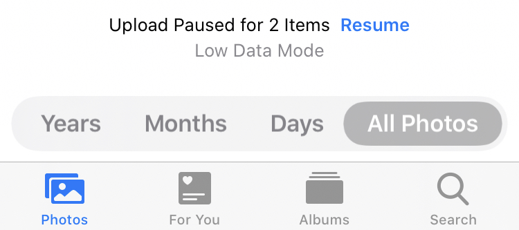 Screenshot showing paused photo upload