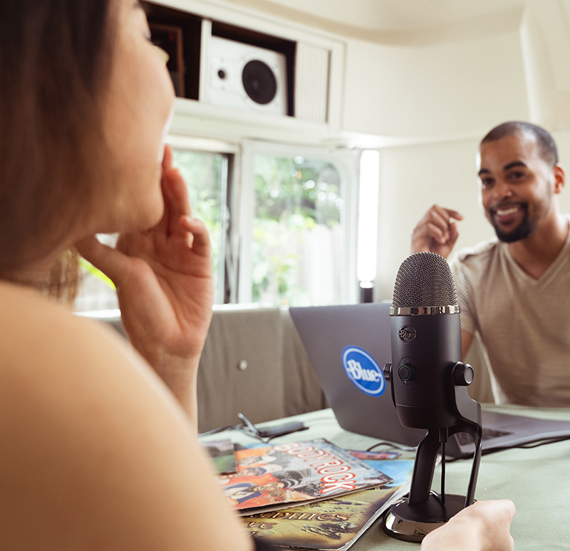 Interview between podcaster and guest with the Blue Yeti X between them