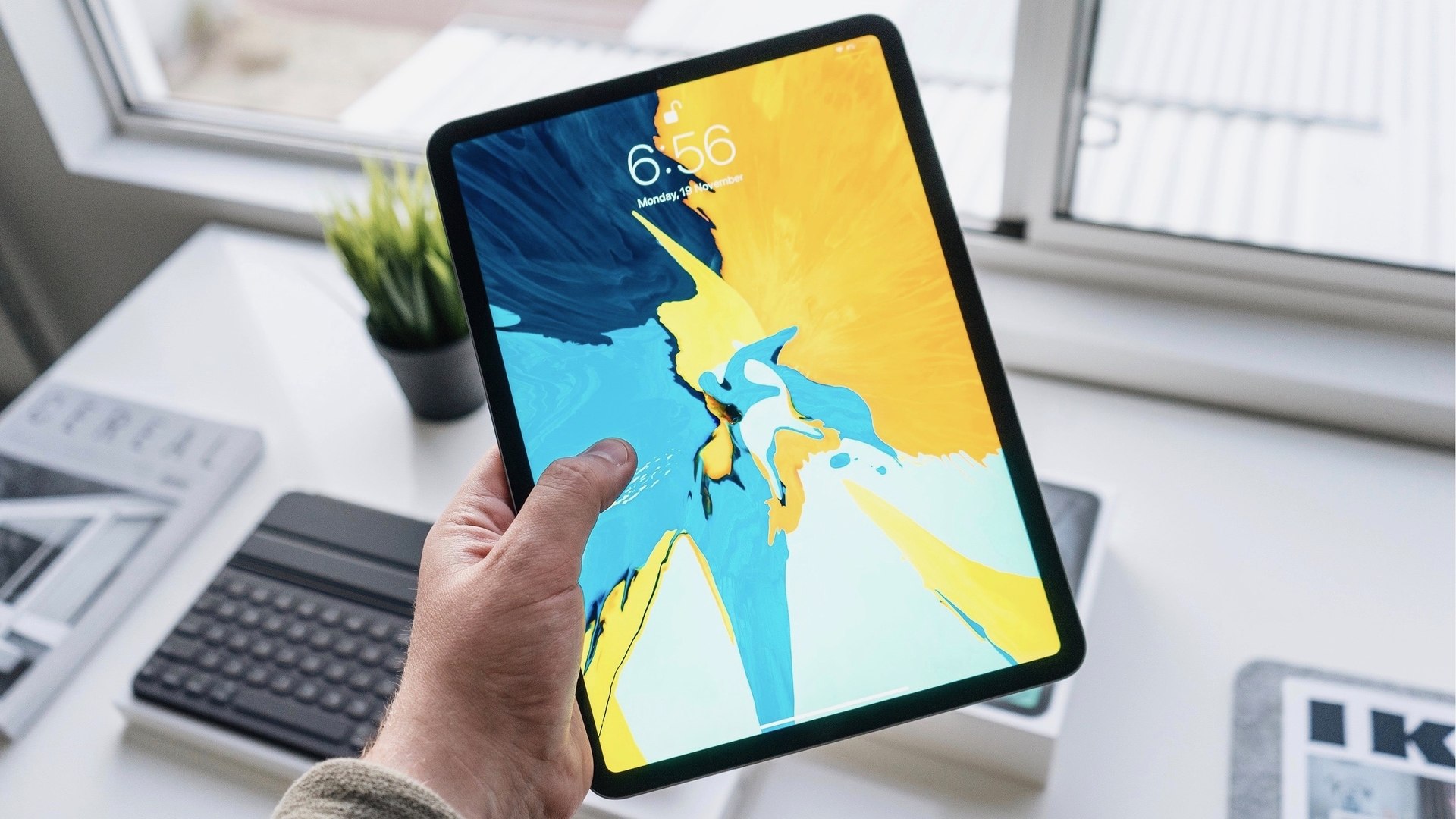 iPad Pro in hand and unlocked with Face I D